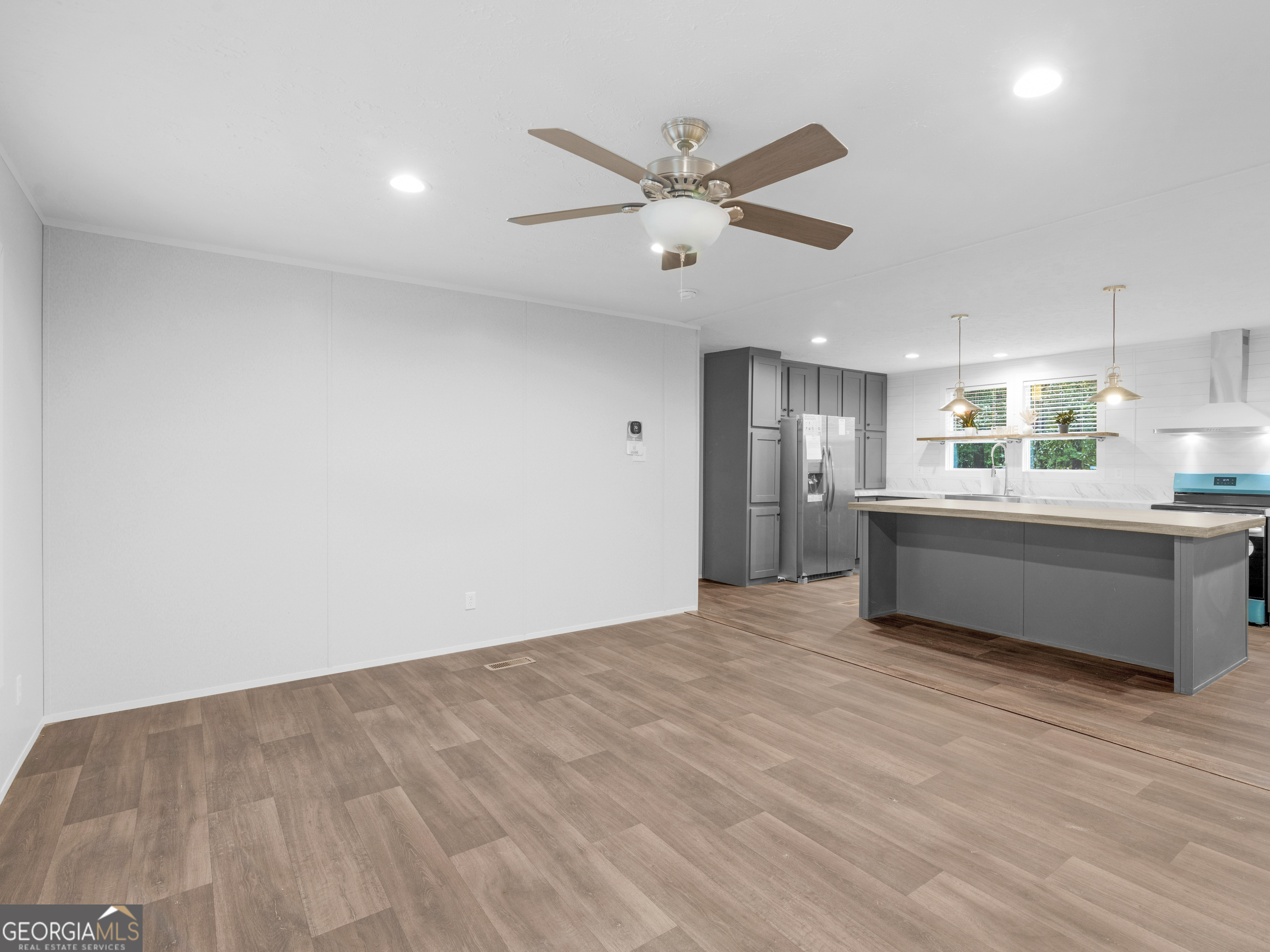 115 Gregory Lane Eatonton, GA 31024 - Photo 21 of 62 a view of a kitchen with a sink and cabinet wooden floor