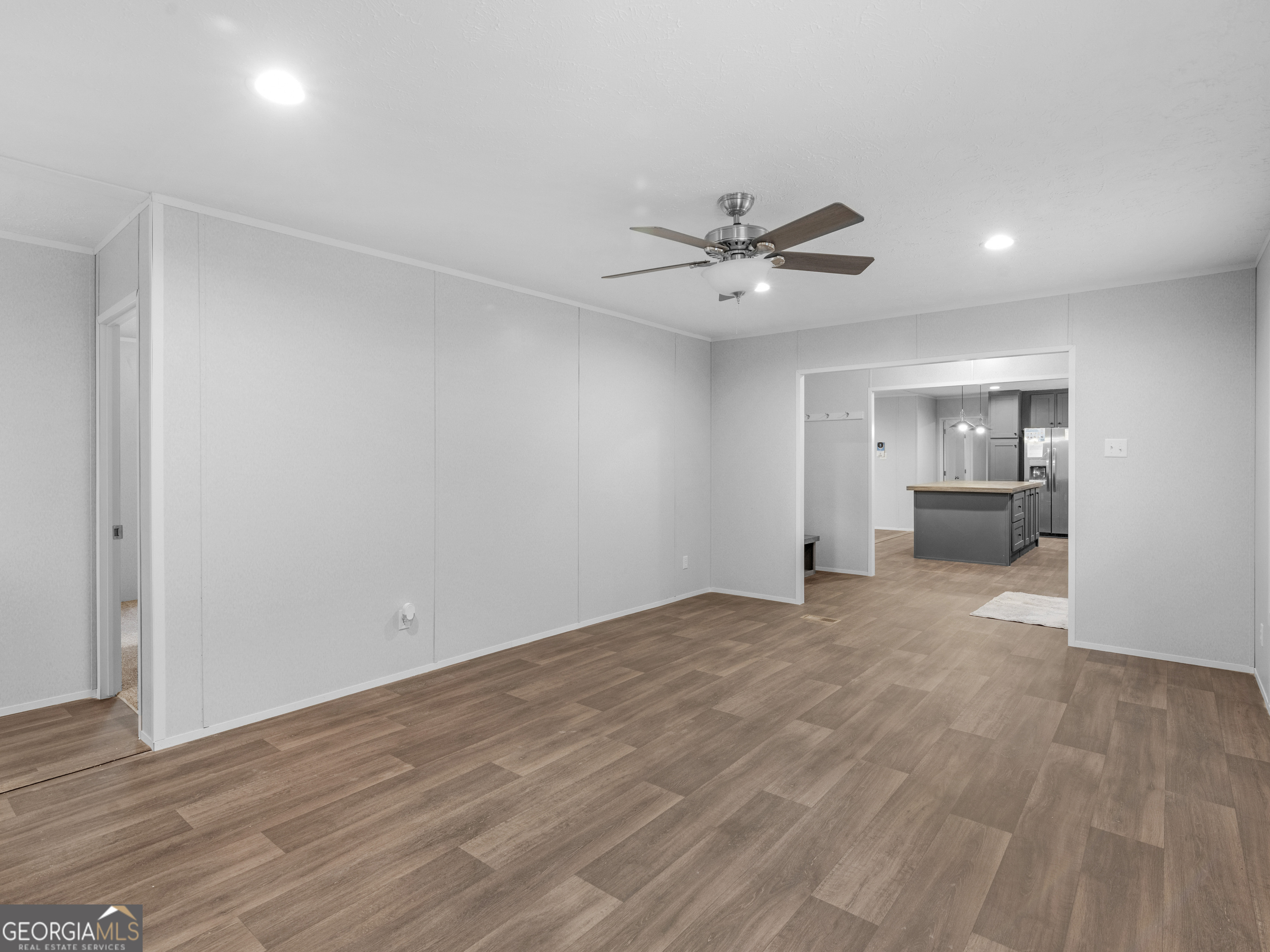 115 Gregory Lane Eatonton, GA 31024 - Photo 25 of 62 a view of an empty room with a kitchen