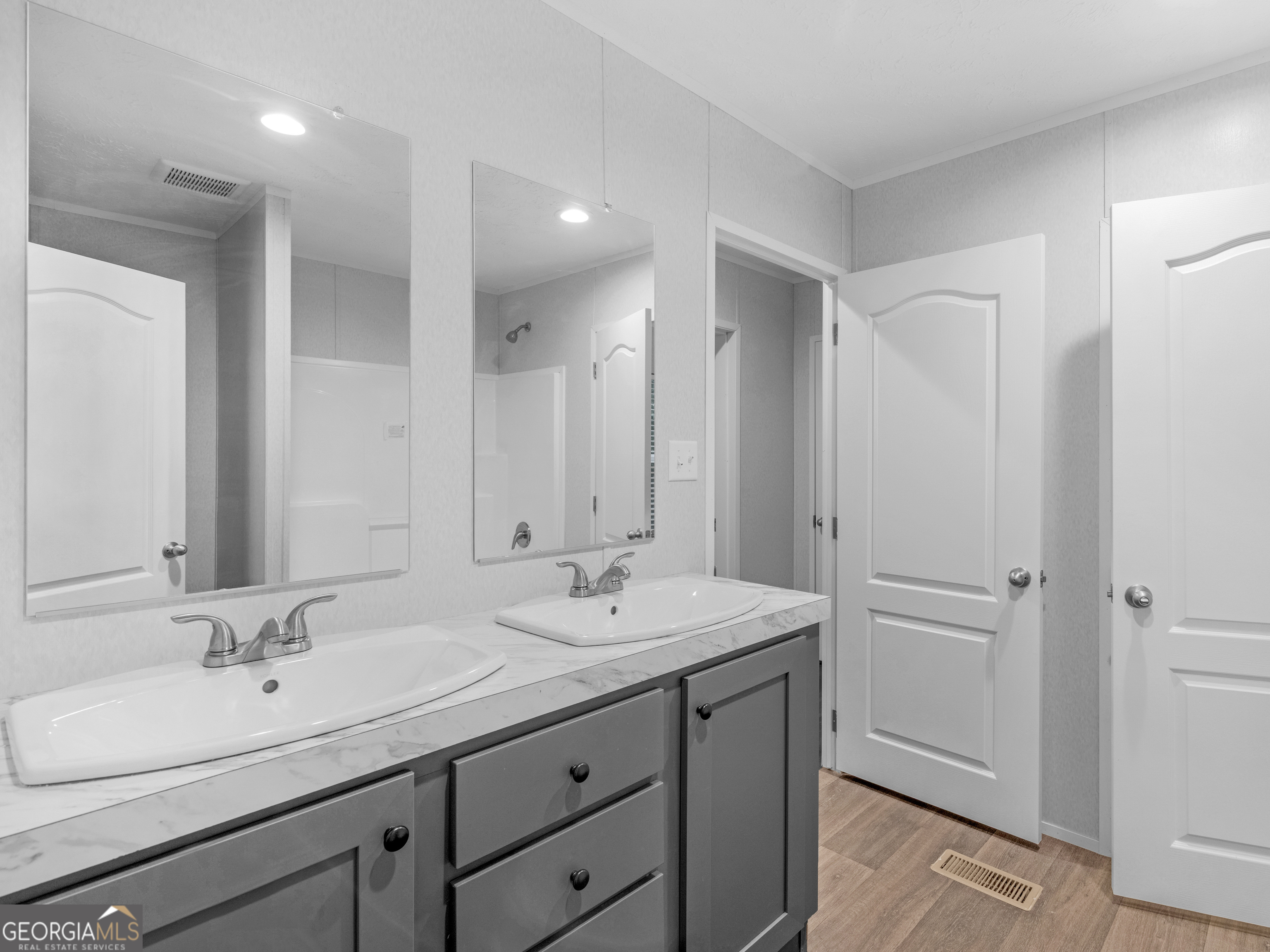 115 Gregory Lane Eatonton, GA 31024 - Photo 30 of 62 a bathroom with a sink double vanity and a mirror