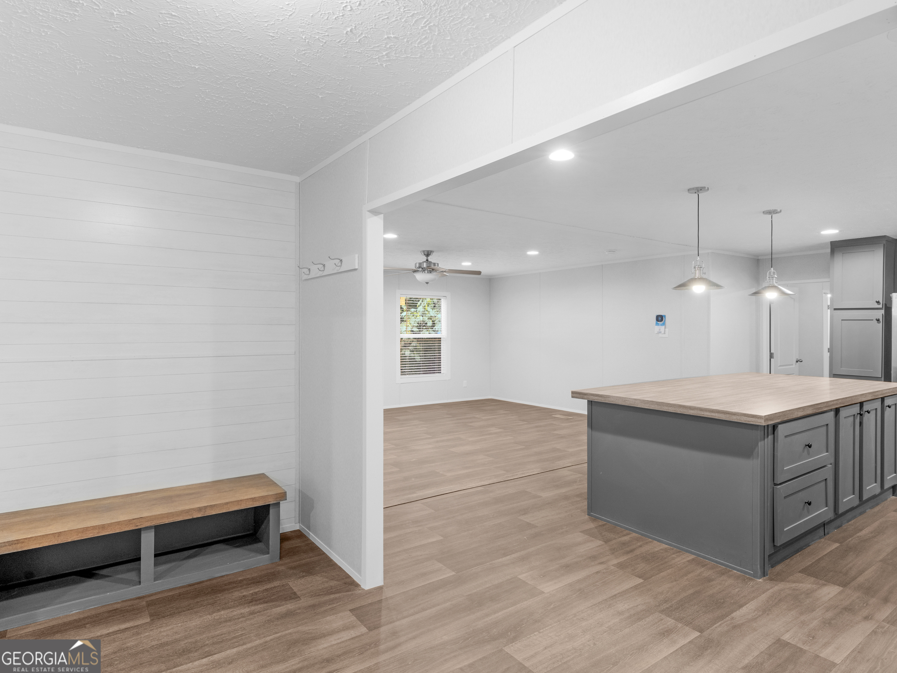 115 Gregory Lane Eatonton, GA 31024 - Photo 3 of 62 a spacious bathroom with a granite countertop sink and a mirror