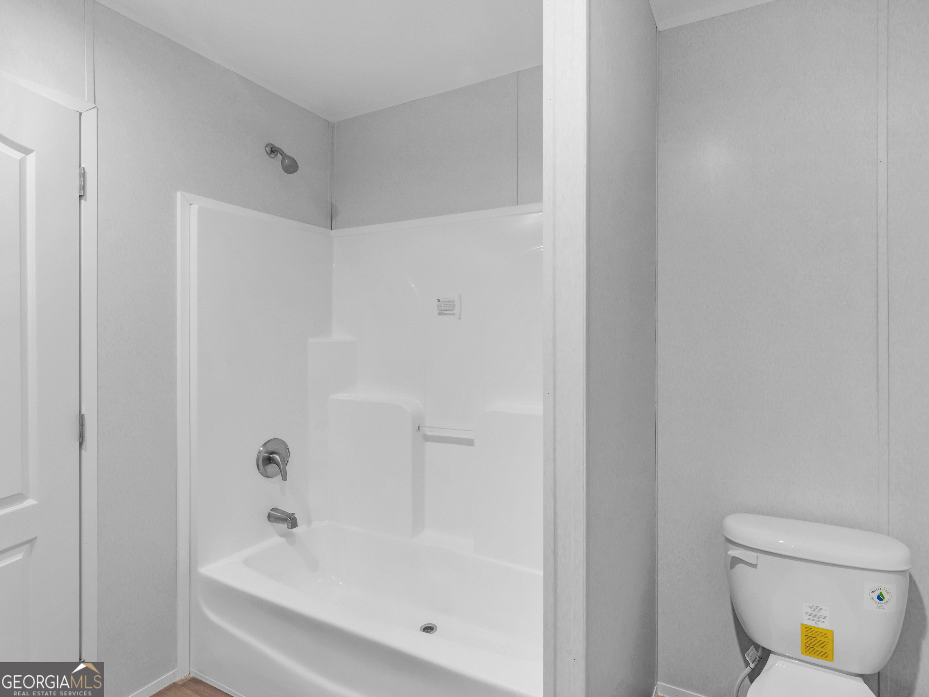 115 Gregory Lane Eatonton, GA 31024 - Photo 31 of 62 a bathroom with a bathtub and a toilet