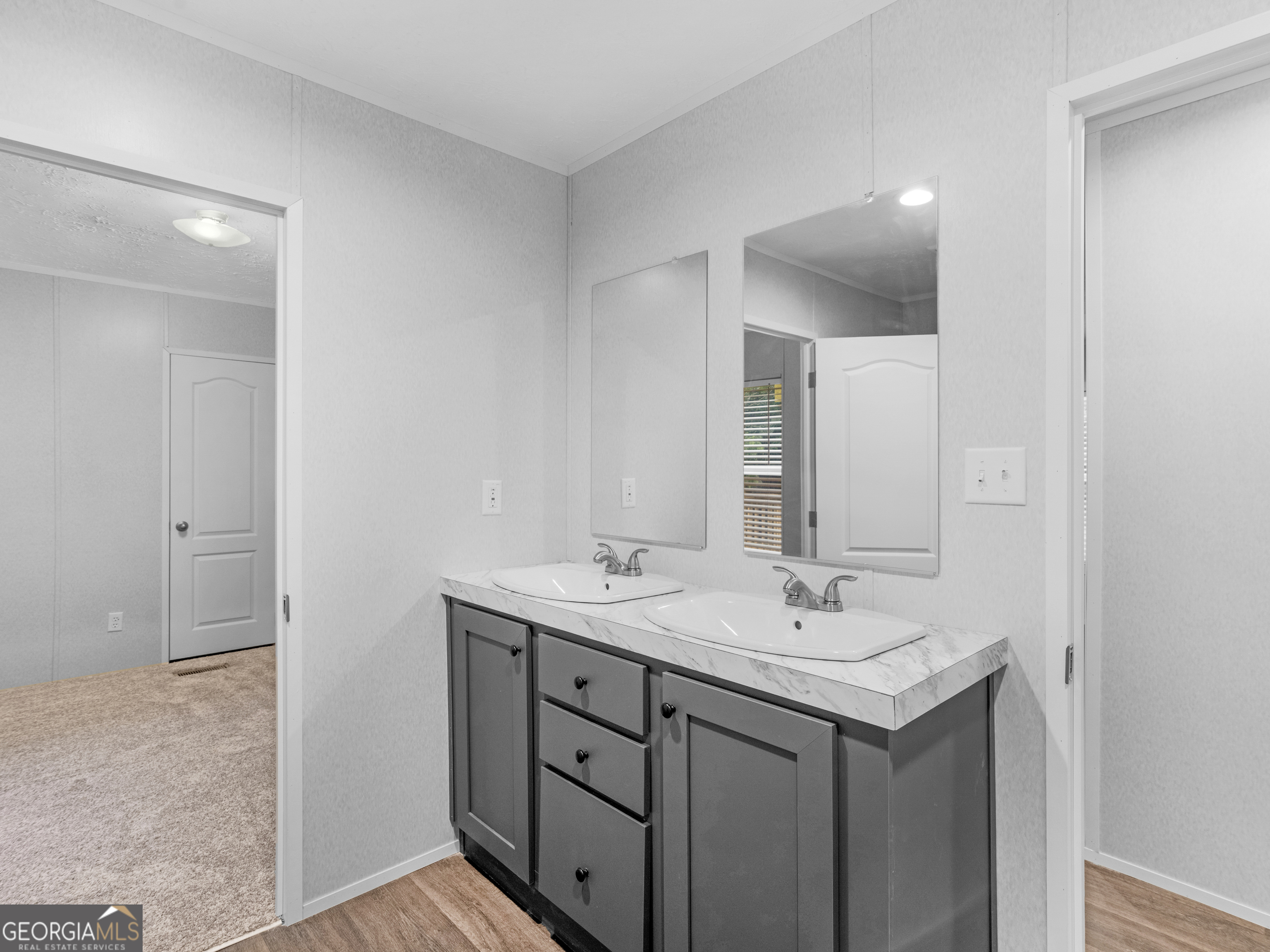 115 Gregory Lane Eatonton, GA 31024 - Photo 32 of 62 a bathroom with a sink and a mirror