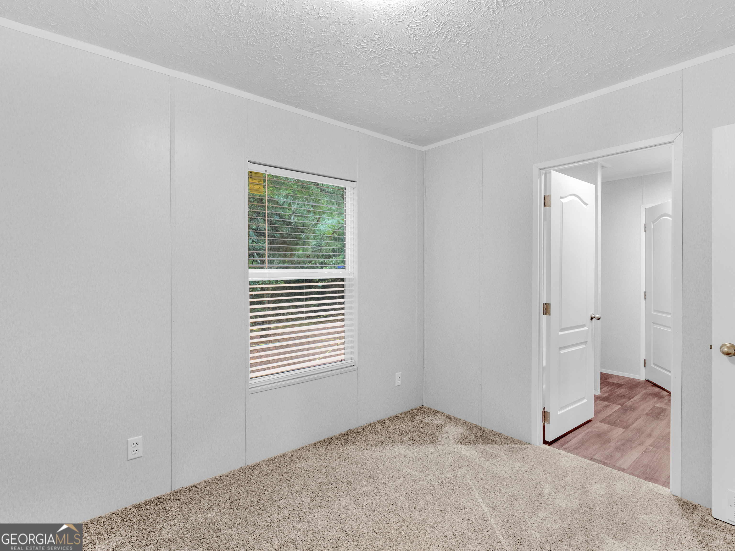 115 Gregory Lane Eatonton, GA 31024 - Photo 37 of 62 a view of an empty room with a window