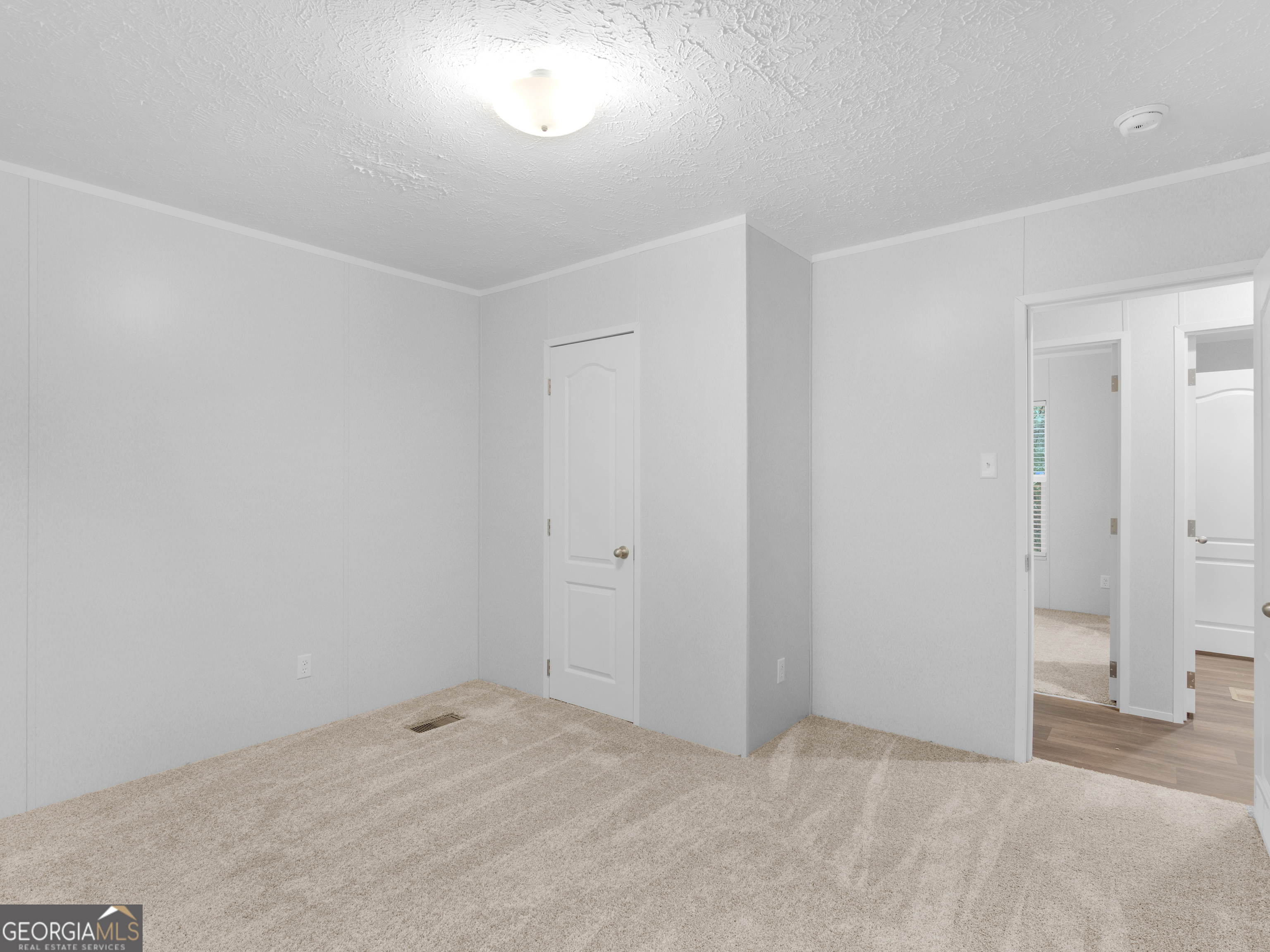 115 Gregory Lane Eatonton, GA 31024 - Photo 41 of 62 a view of an empty room