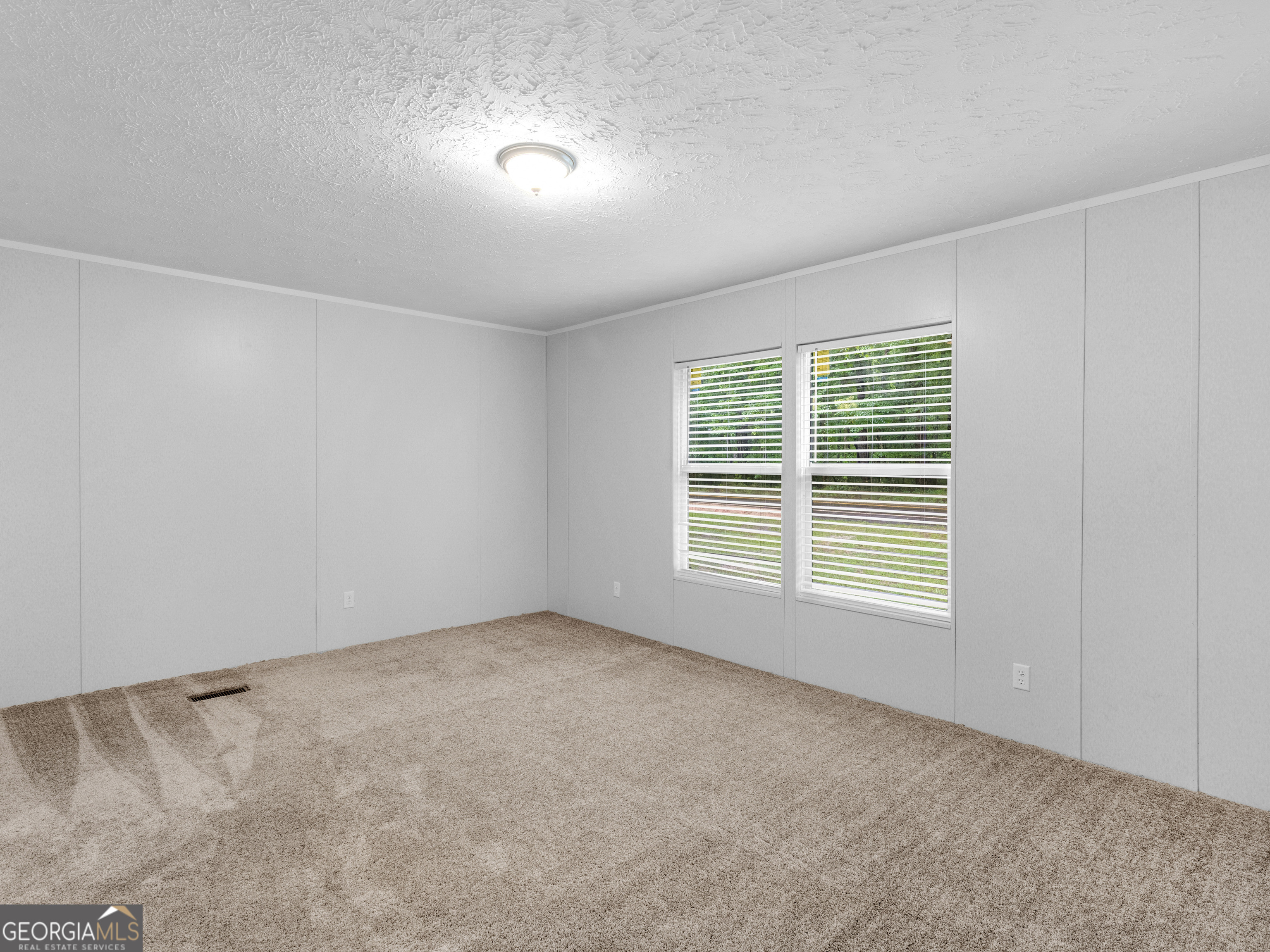 115 Gregory Lane Eatonton, GA 31024 - Photo 42 of 62 an empty room with a window