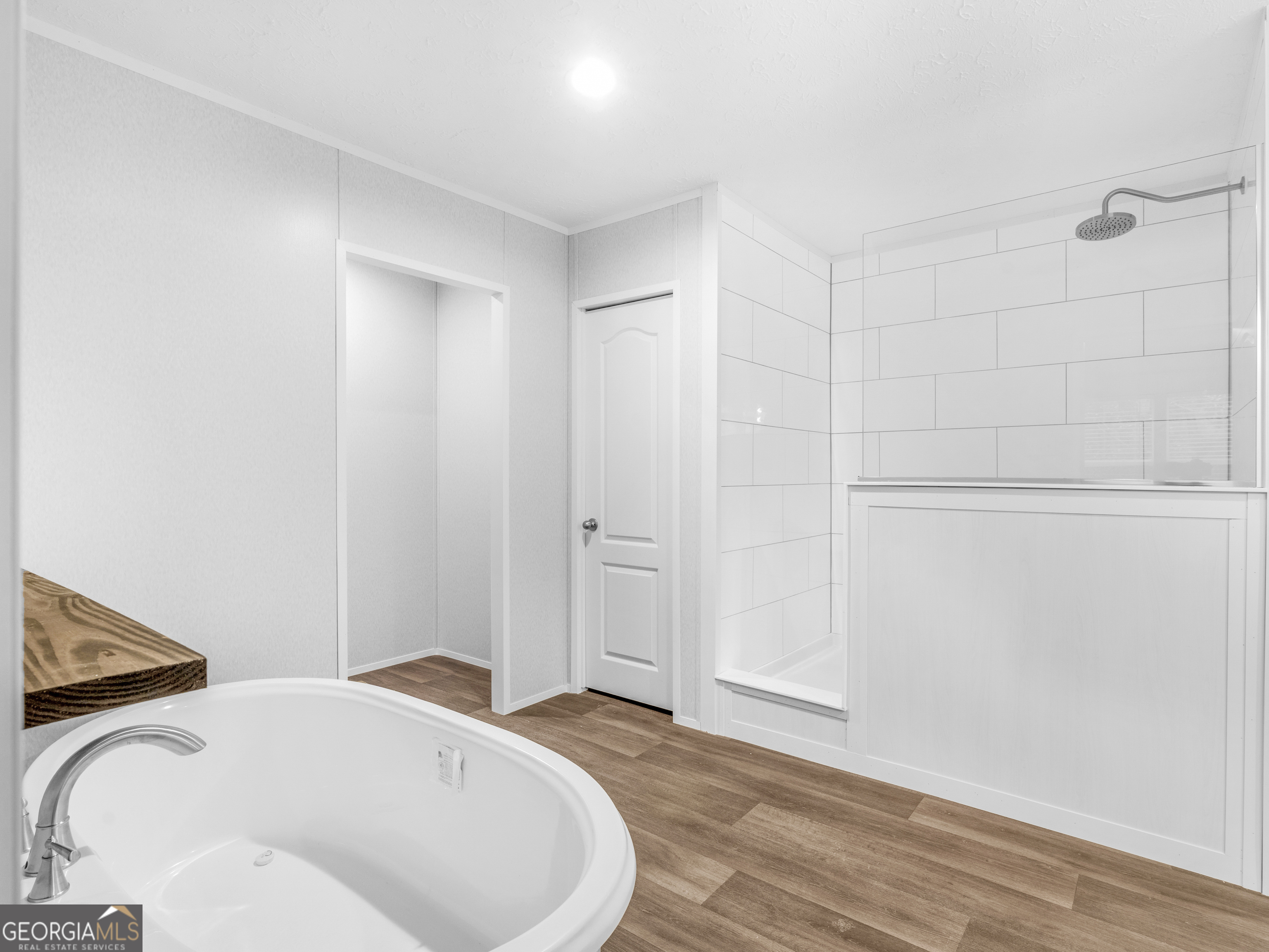 115 Gregory Lane Eatonton, GA 31024 - Photo 46 of 62 a bedroom with a bed and wooden floor