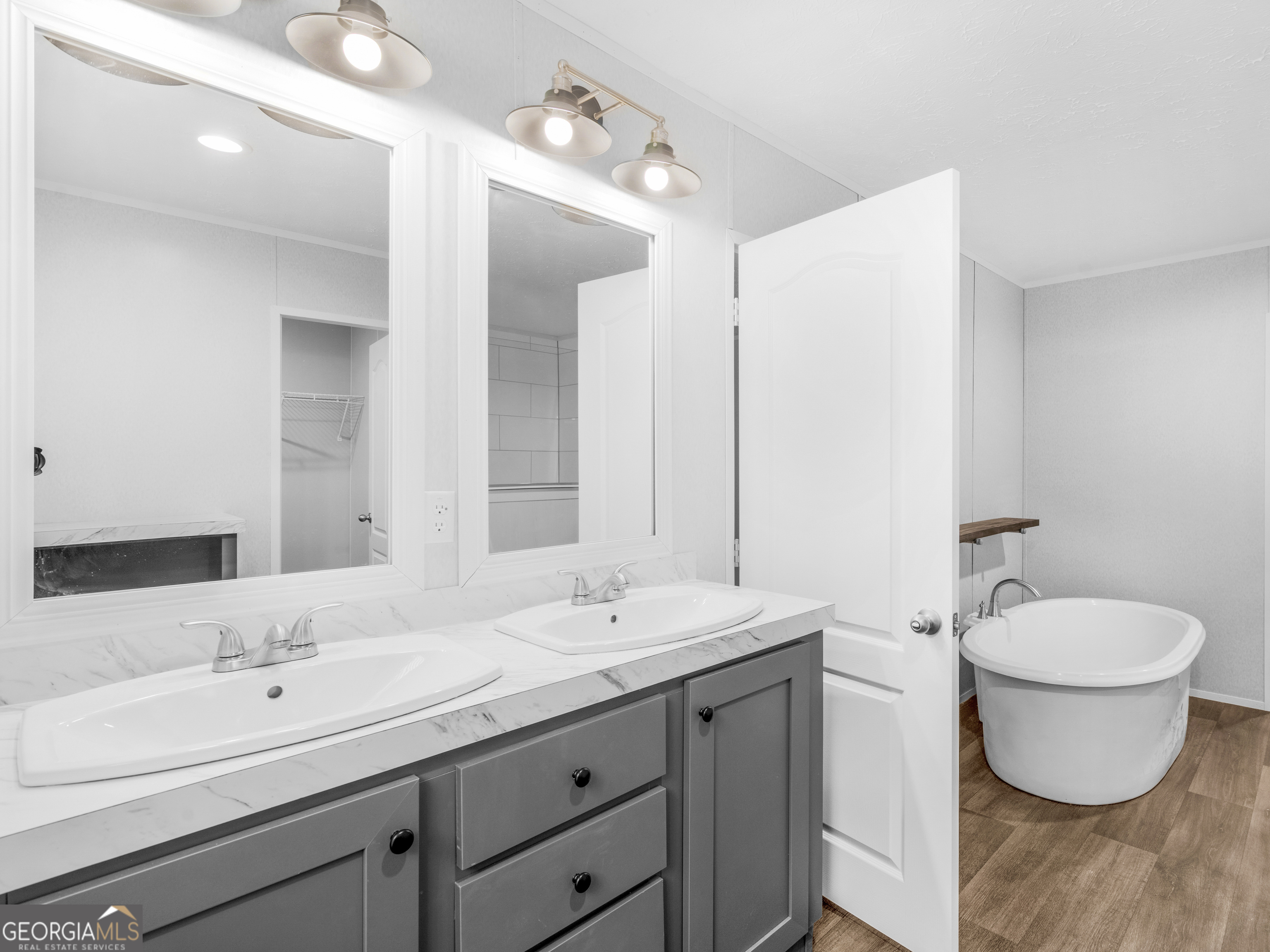 115 Gregory Lane Eatonton, GA 31024 - Photo 49 of 62 a bathroom with a toilet sink and mirror