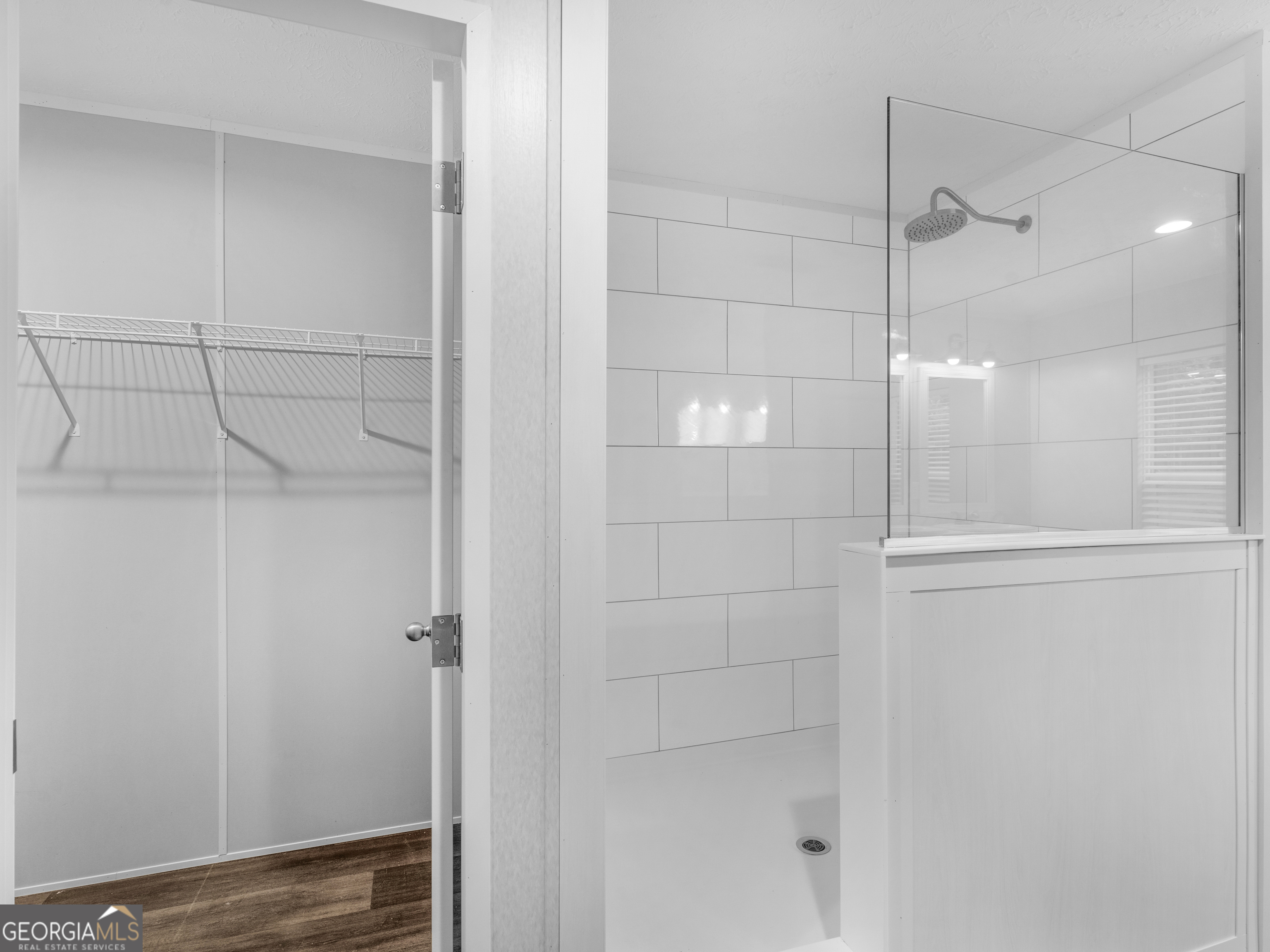 115 Gregory Lane Eatonton, GA 31024 - Photo 52 of 62 a bathroom with a glass shower door