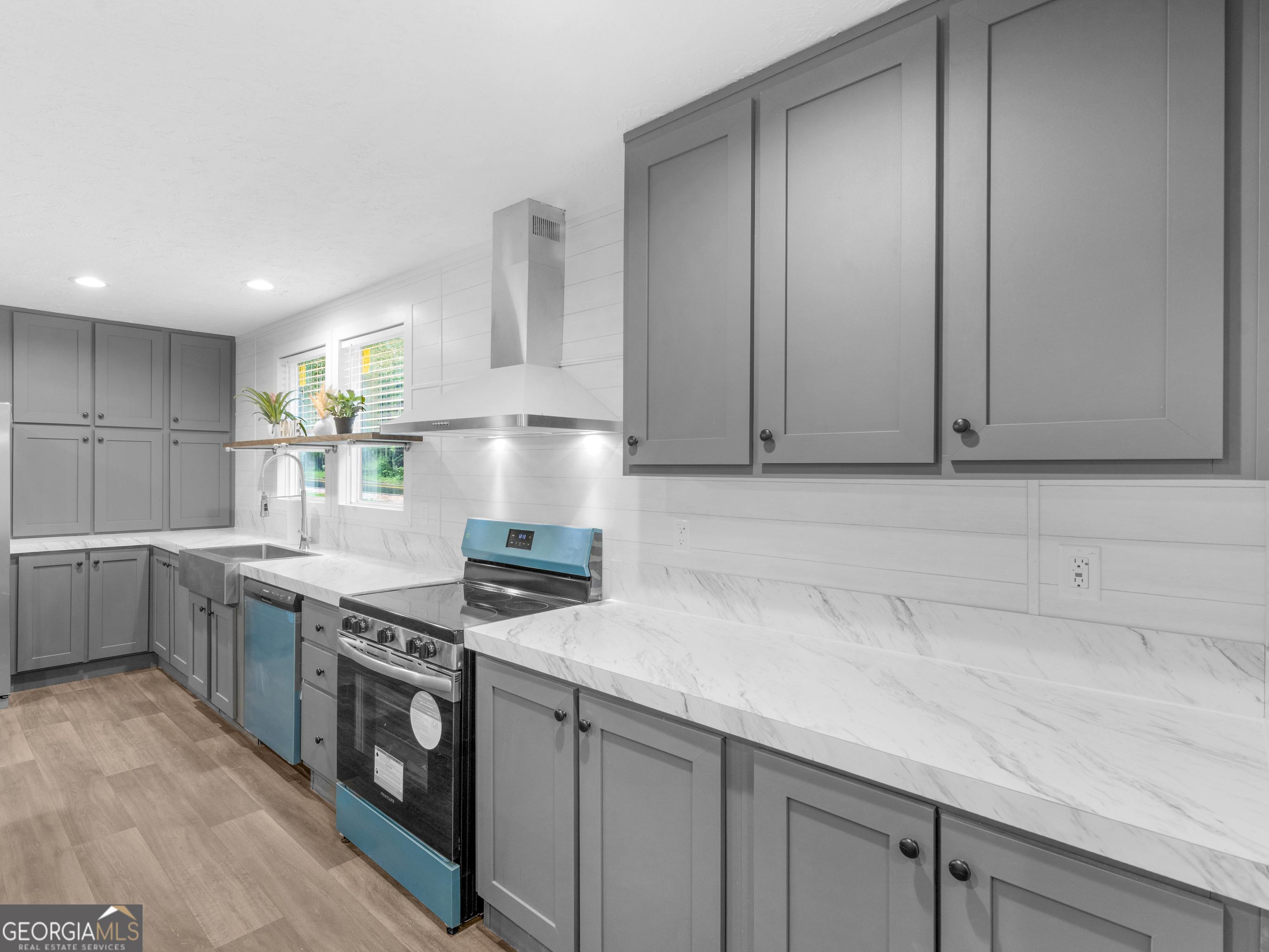 115 Gregory Lane Eatonton, GA 31024 - Photo 8 of 62 a kitchen with stainless steel appliances granite countertop a sink stove and cabinets