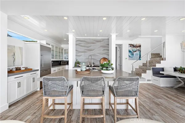 a kitchen with cabinets and window