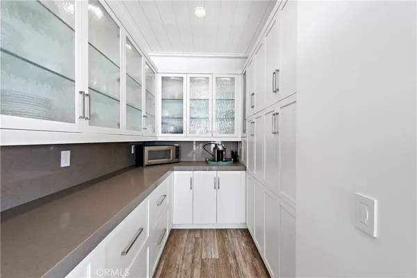 a kitchen with stainless steel appliances granite countertop a sink and cabinets