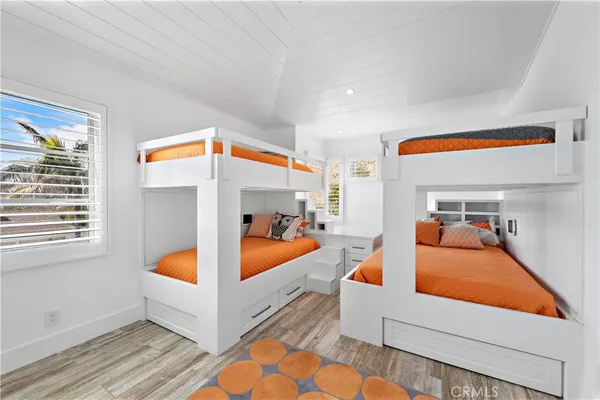 a bedroom with furniture and a window