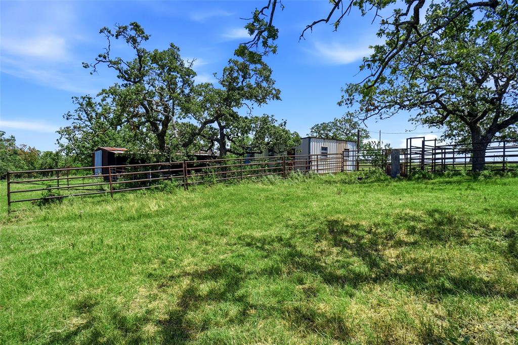 2186 Gilliland Road Springtown, TX 76082 - Photo 9 of 25 Expansive green space featuring perimeter fencing and mature trees