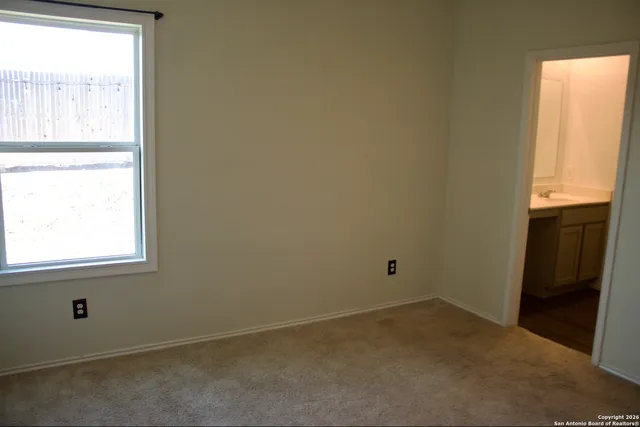 a kitchen with kitchen island sink and refrigerator