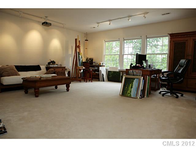 2538 Lower Assembly Drive Fort Mill, SC 29708 - Photo 13 of 16 a living room with furniture gym equipment and a large window