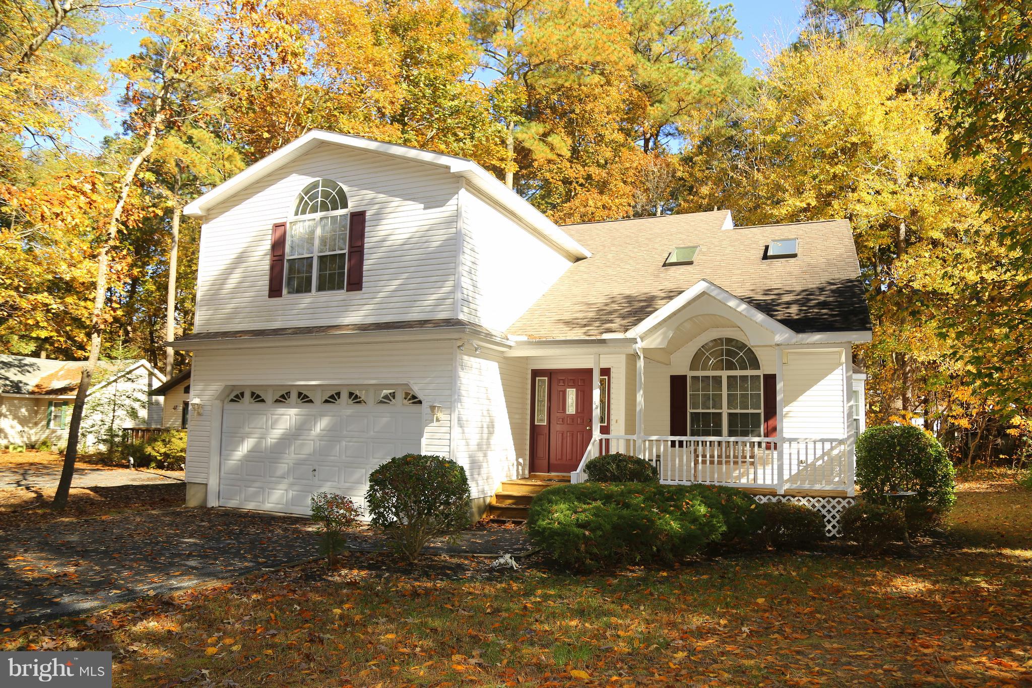 43 Falcon Bridge Road Ocean Pines, MD 21811 - Photo 1 of 30 a front view of a house with garden