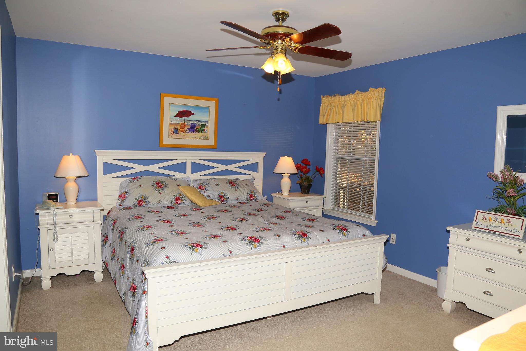 43 Falcon Bridge Road Ocean Pines, MD 21811 - Photo 12 of 30 a bedroom with a bed and a chandelier