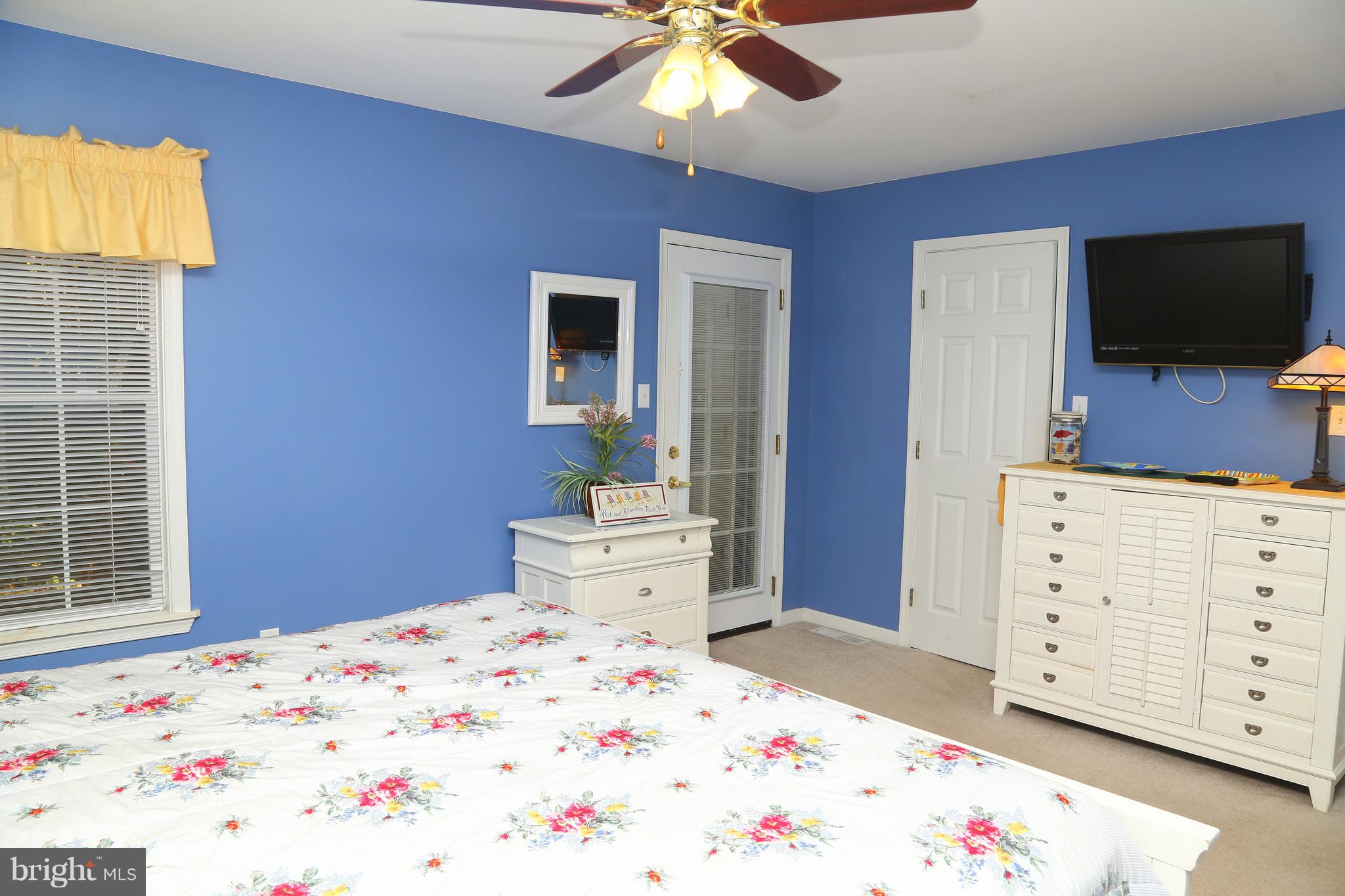 43 Falcon Bridge Road Ocean Pines, MD 21811 - Photo 13 of 30 a bedroom with a bed and a flat screen tv