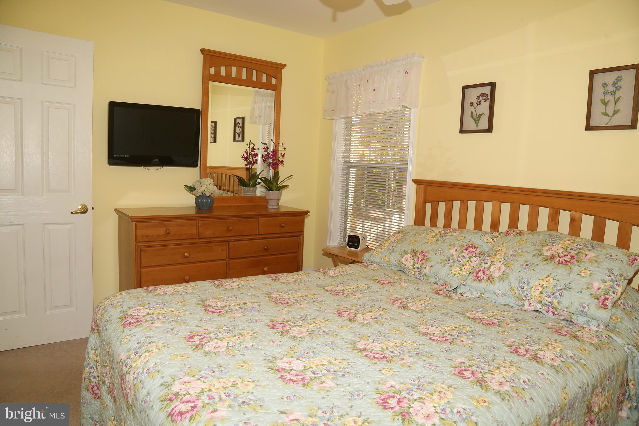 43 Falcon Bridge Road Ocean Pines, MD 21811 - Photo 17 of 30 a bedroom with a bed and a flat screen tv