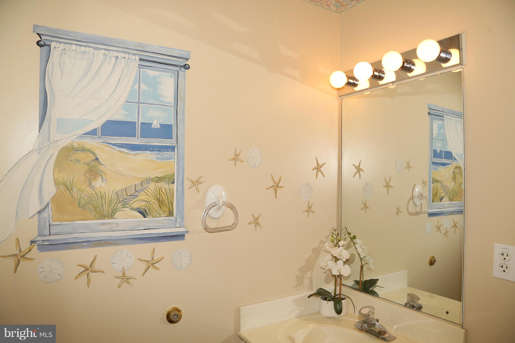43 Falcon Bridge Road Ocean Pines, MD 21811 - Photo 18 of 30 a bathroom with a sink a mirror and a shower