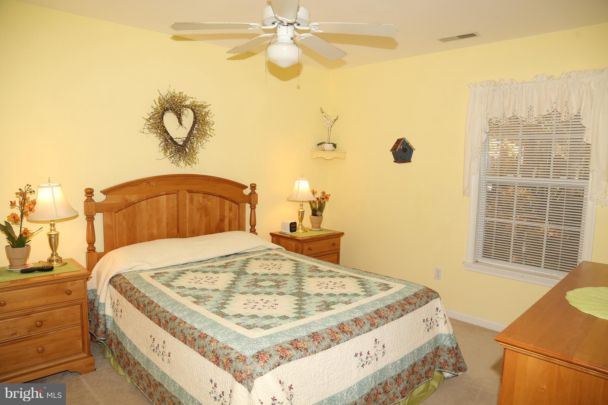 43 Falcon Bridge Road Ocean Pines, MD 21811 - Photo 20 of 30 a bedroom with a bed and a window