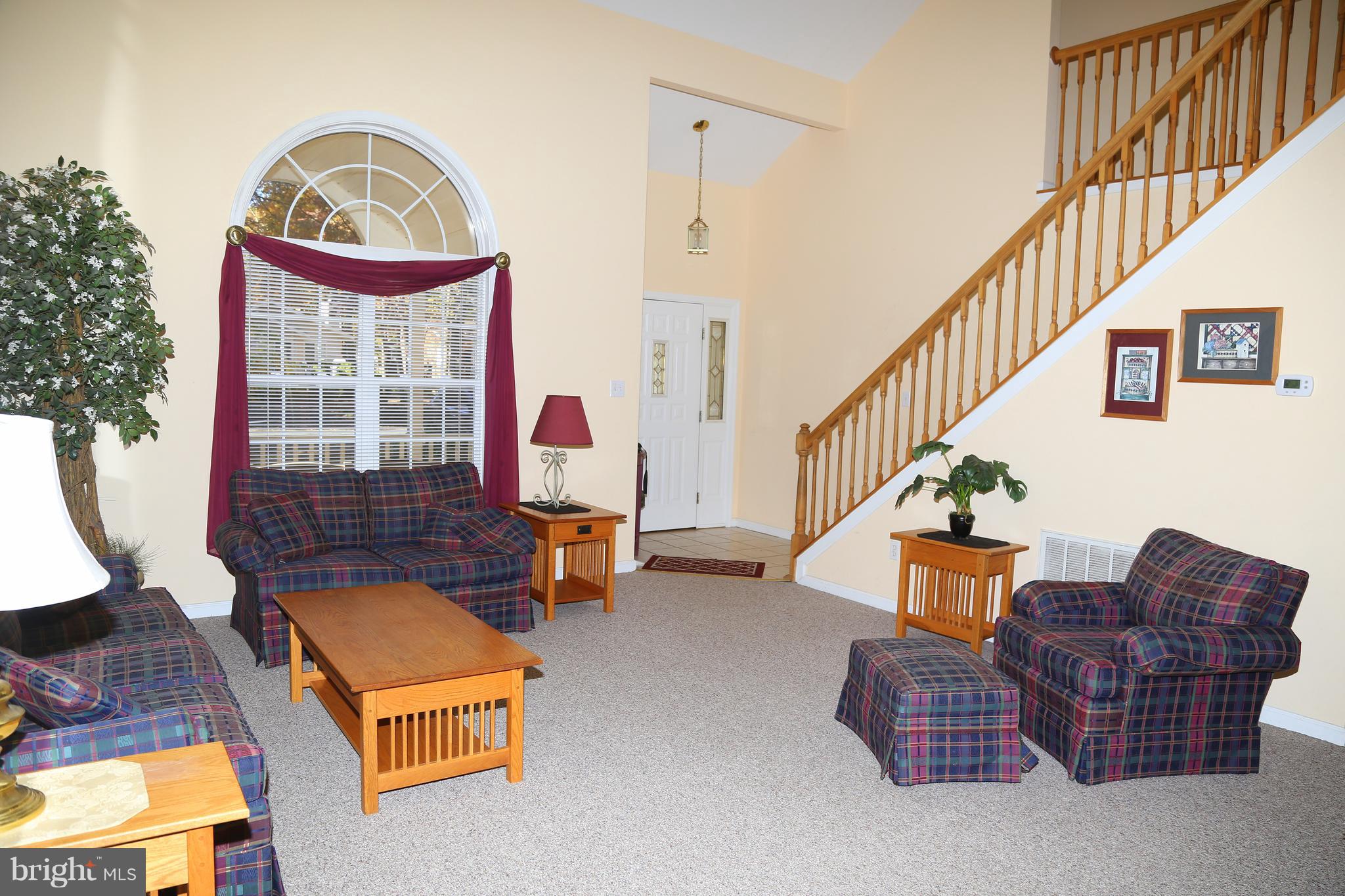 43 Falcon Bridge Road Ocean Pines, MD 21811 - Photo 2 of 30 a living room with furniture a rug and a window