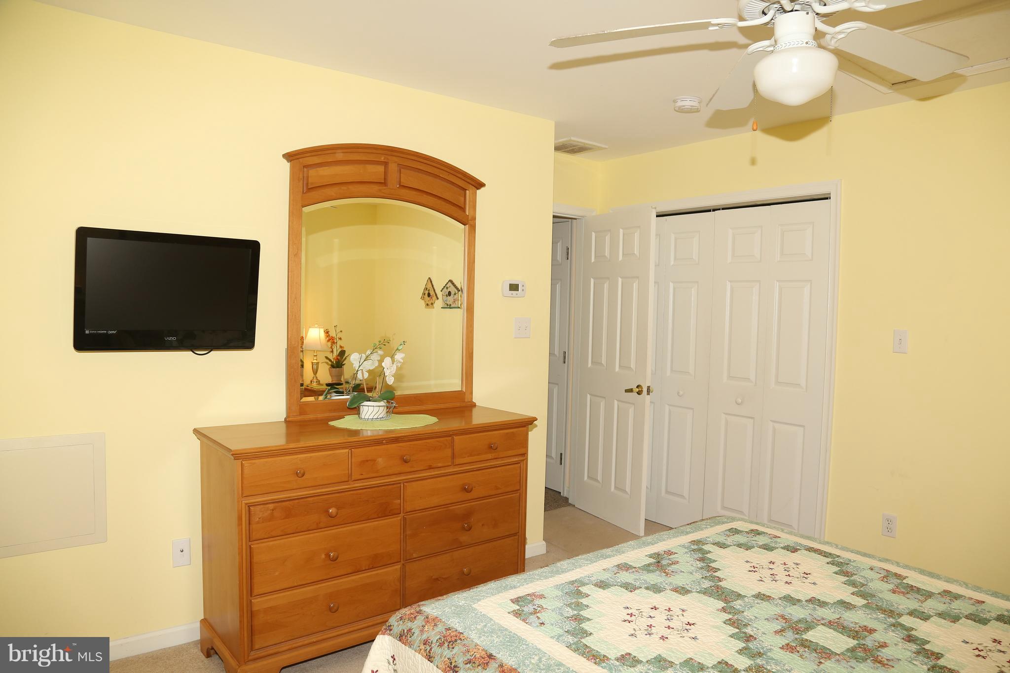 43 Falcon Bridge Road Ocean Pines, MD 21811 - Photo 21 of 30 a bedroom with a bed and a flat screen tv