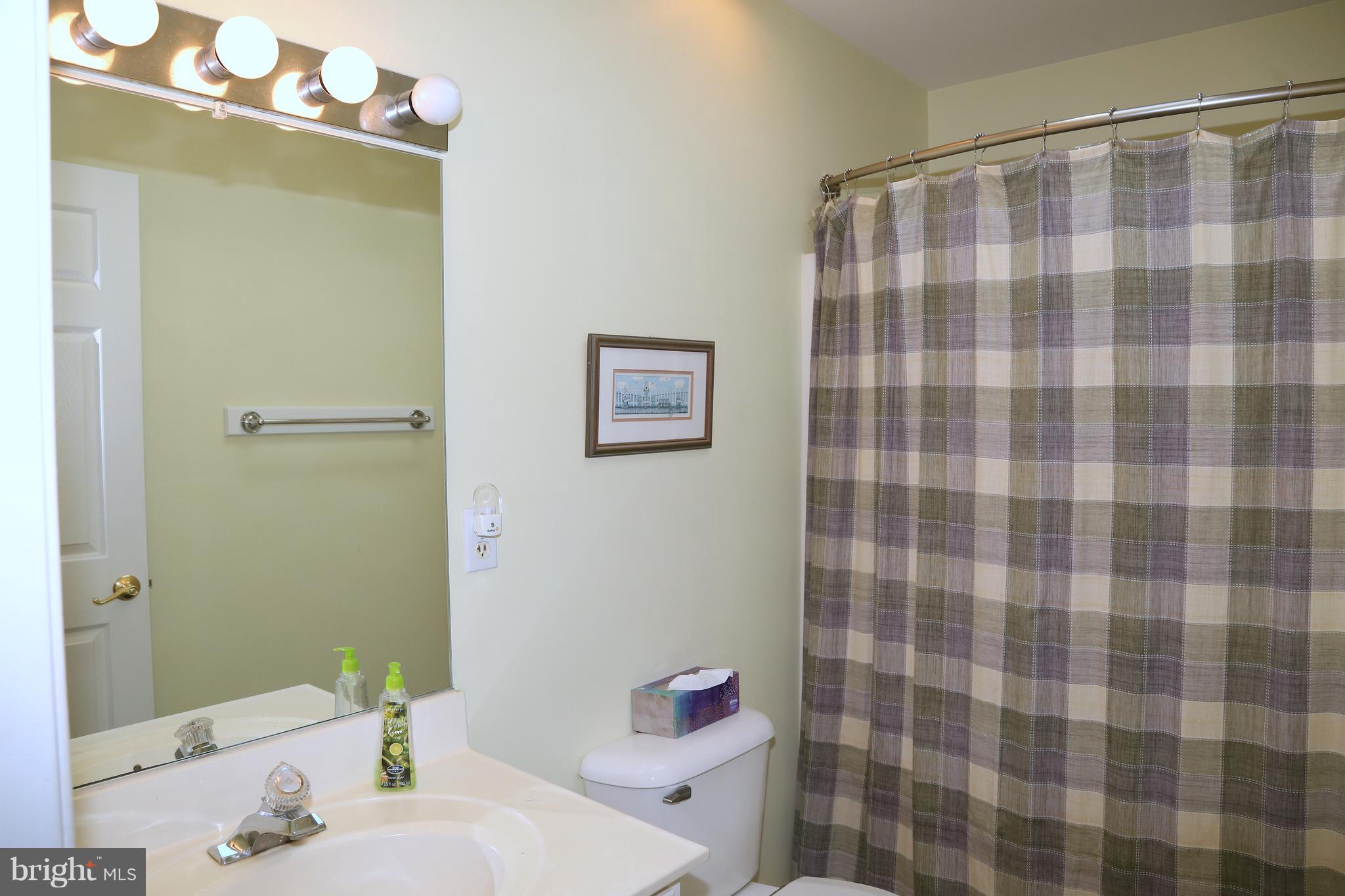 43 Falcon Bridge Road Ocean Pines, MD 21811 - Photo 22 of 30 a bathroom with a sink a toilet and shower