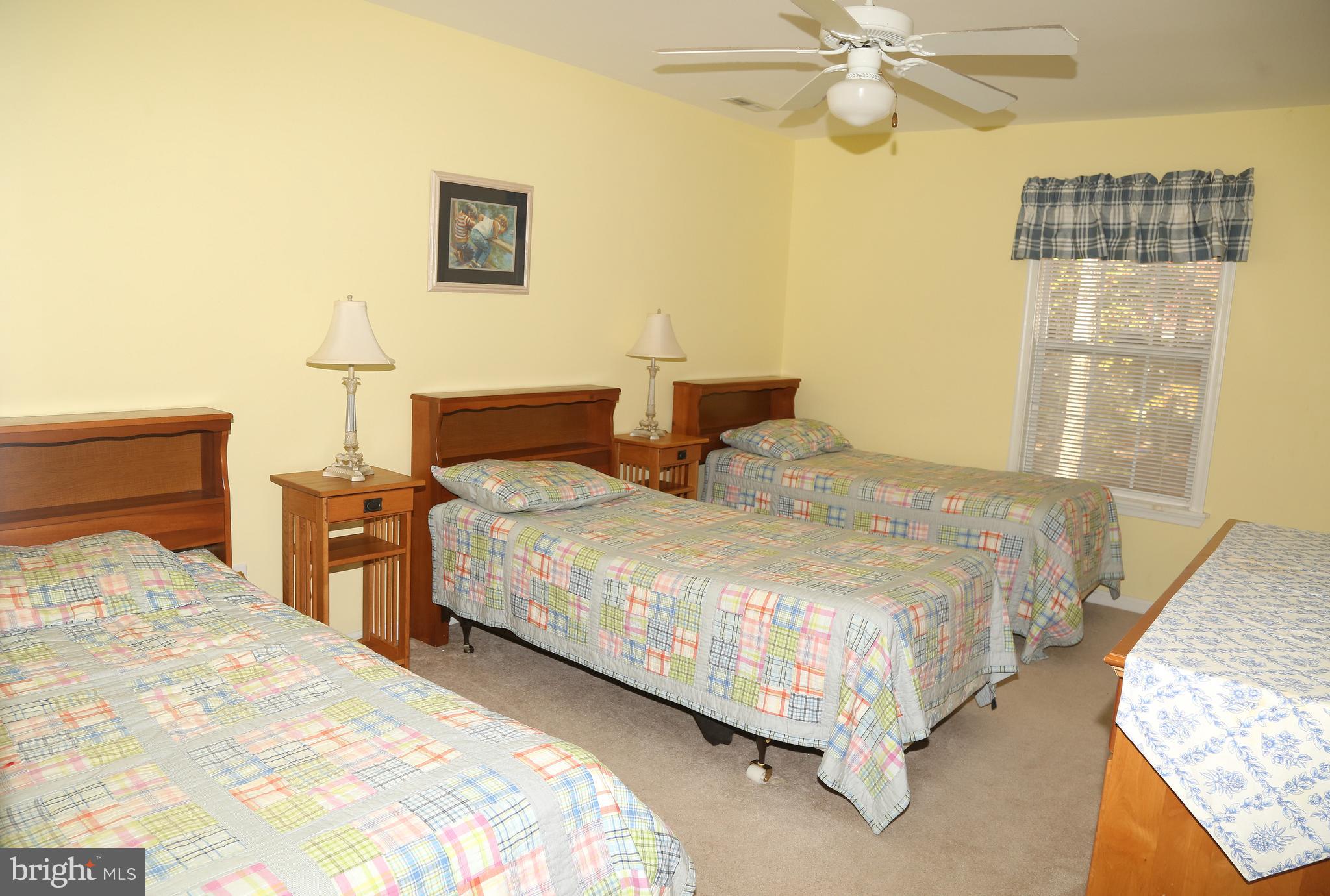 43 Falcon Bridge Road Ocean Pines, MD 21811 - Photo 23 of 30 a bedroom with two beds and painting on the wall