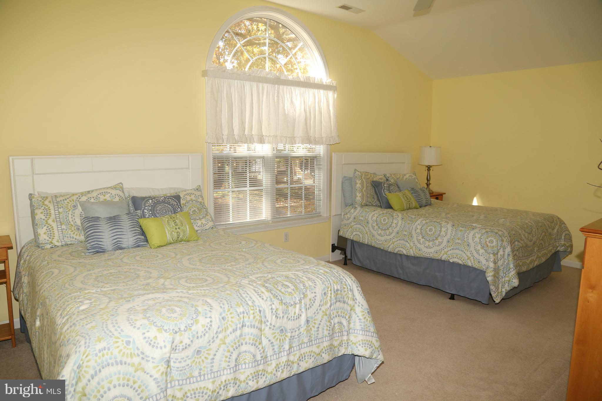43 Falcon Bridge Road Ocean Pines, MD 21811 - Photo 25 of 30 a bedroom with a bed and a window
