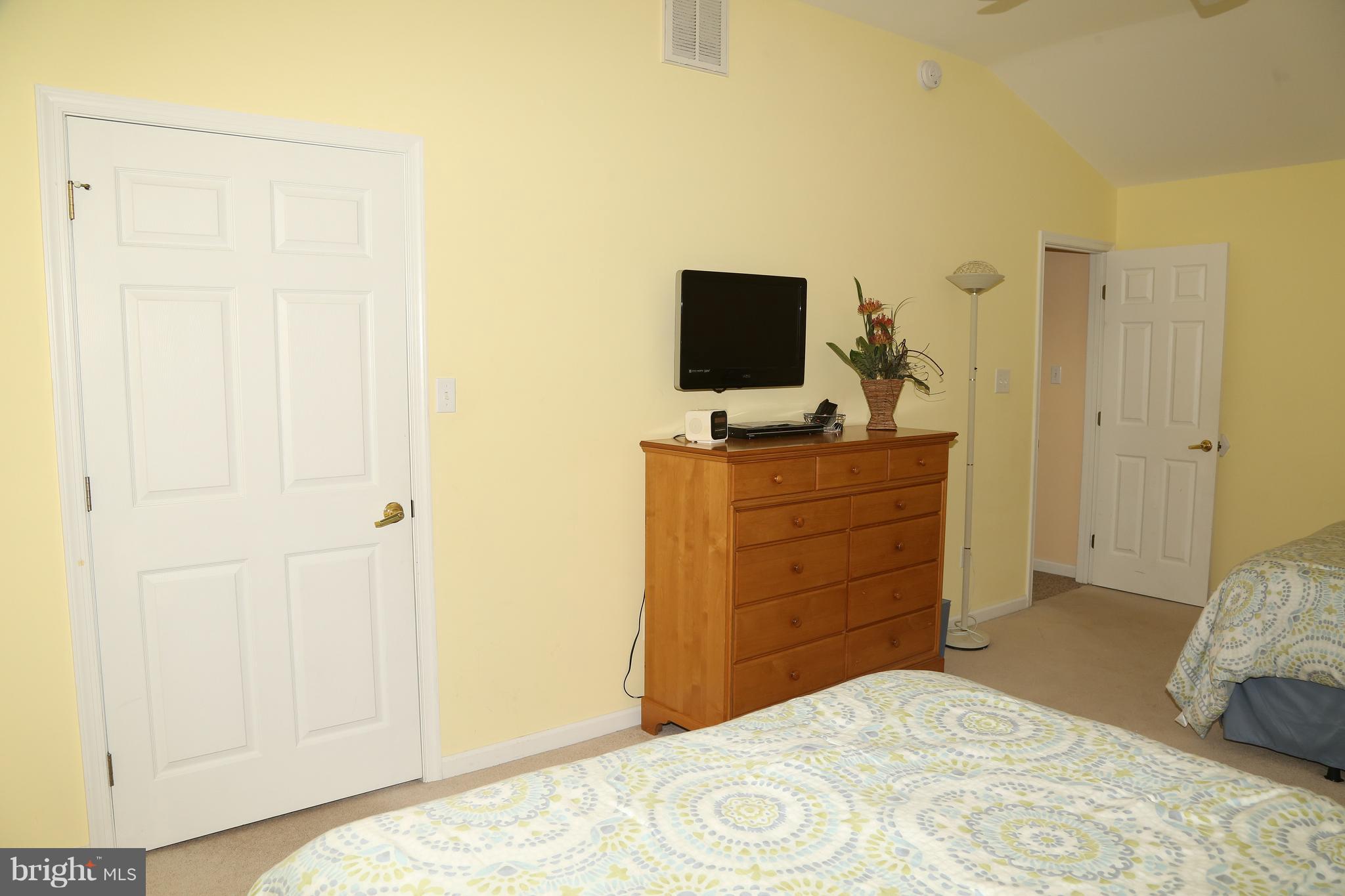43 Falcon Bridge Road Ocean Pines, MD 21811 - Photo 26 of 30 a bedroom with a bed and a flat screen tv