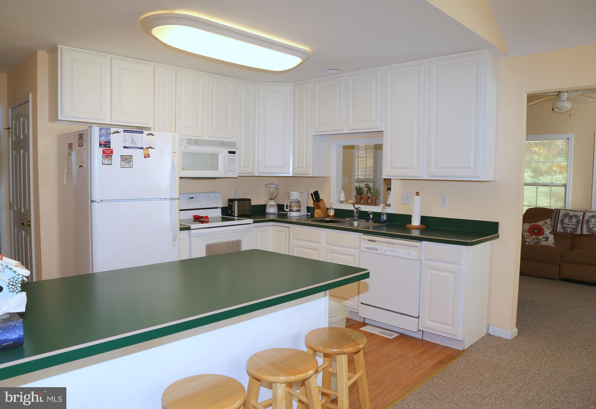 43 Falcon Bridge Road Ocean Pines, MD 21811 - Photo 5 of 30 a kitchen with stainless steel appliances granite countertop a granite counter tops and a refrigerator