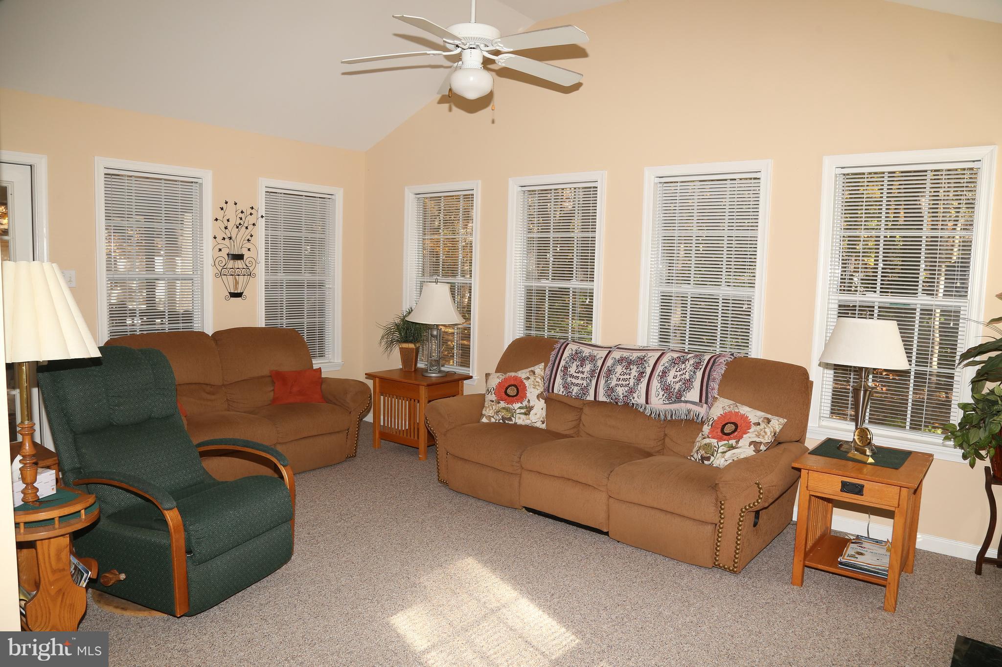 43 Falcon Bridge Road Ocean Pines, MD 21811 - Photo 8 of 30 a living room with furniture and a large window