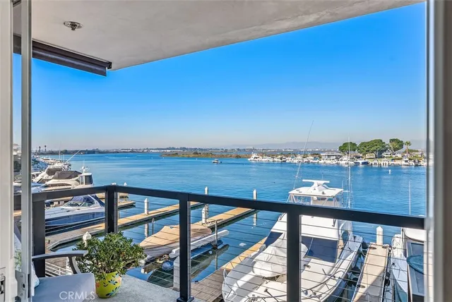 a view of a balcony with chair and wooden floor
