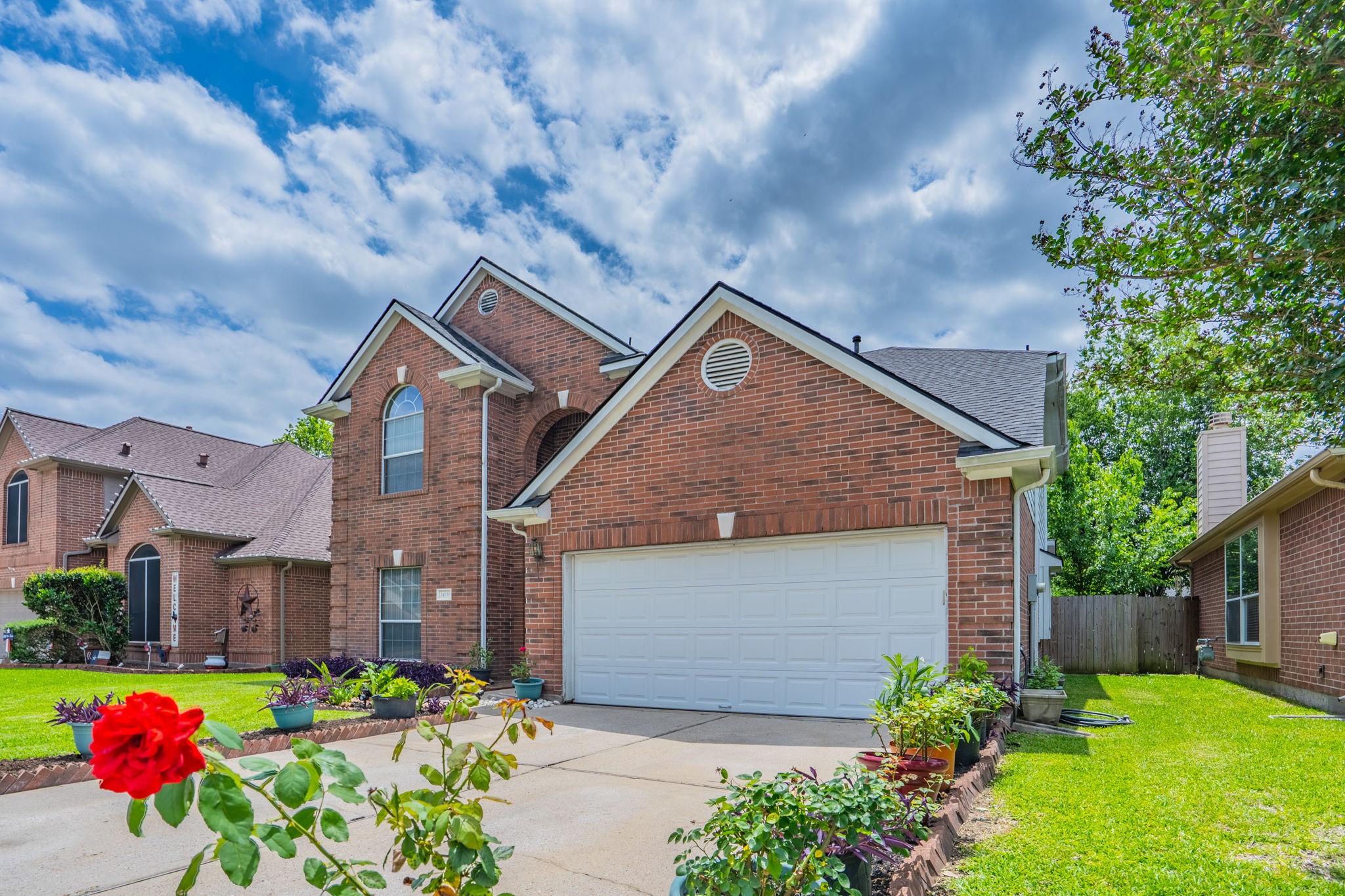 24139 Spring Sunset Drive Spring, TX 77373 - Photo 3 of 26 a front view of a house with a yard