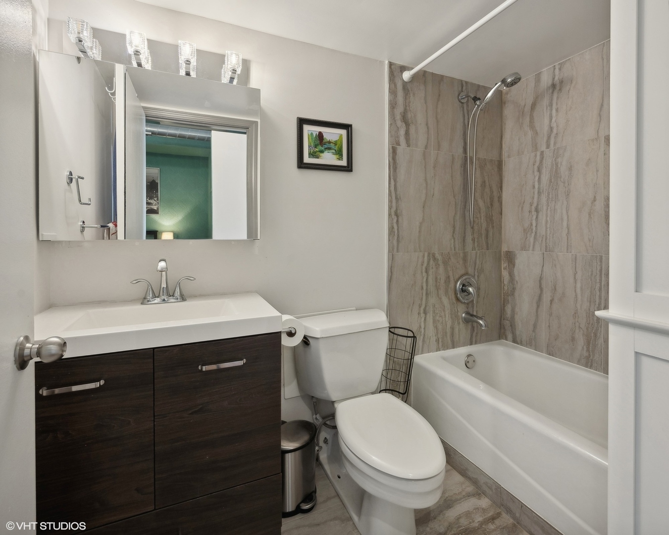 500 South Clinton Street, Unit 227 Chicago, IL 60607 - Photo 8 of 20 a bathroom with a sink toilet and shower