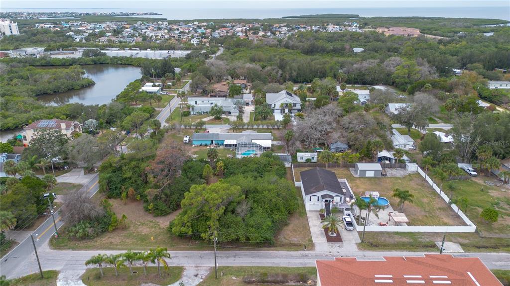 6317 Oelsner Street New Port Richey, FL 34652 - Photo 2 of 8 an aerial view of residential houses with outdoor space and swimming pool