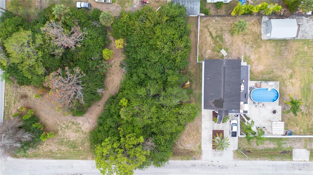6317 Oelsner Street New Port Richey, FL 34652 - Photo 8 of 8 an aerial view of residential houses with outdoor space
