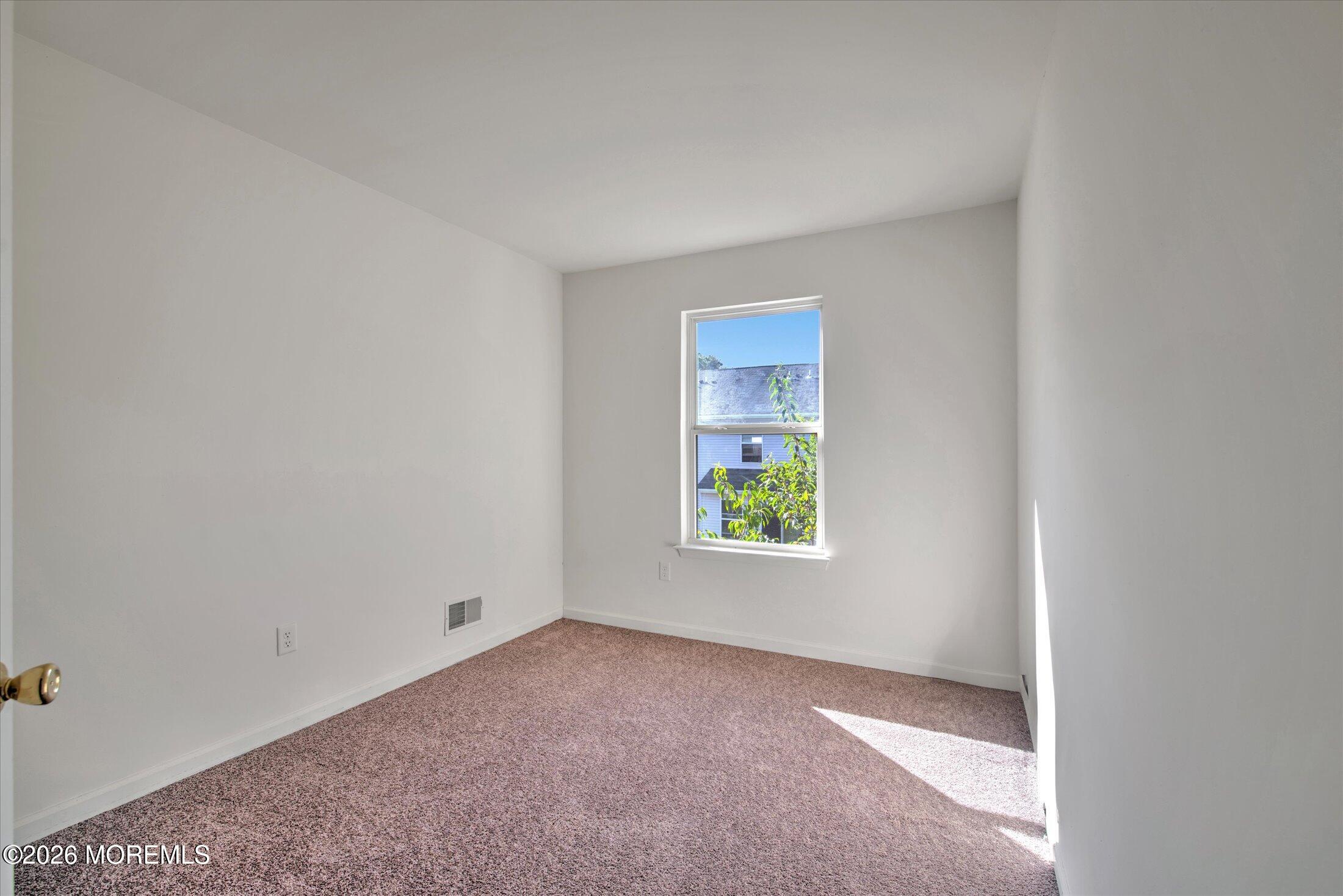 26 Esplanade Way Bayville, NJ 08721 - Photo 39 of 41 an empty room with windows