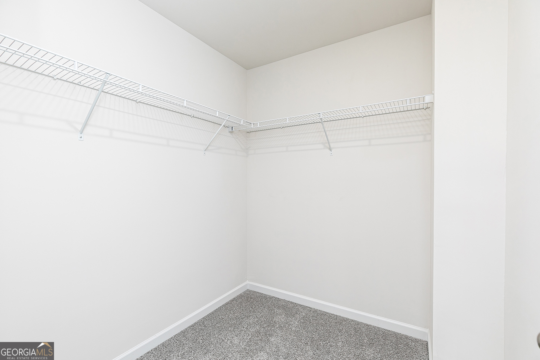 482 Prescott Way Villa Rica, GA 30180 - Photo 15 of 17 a view of a room with racks on the wall