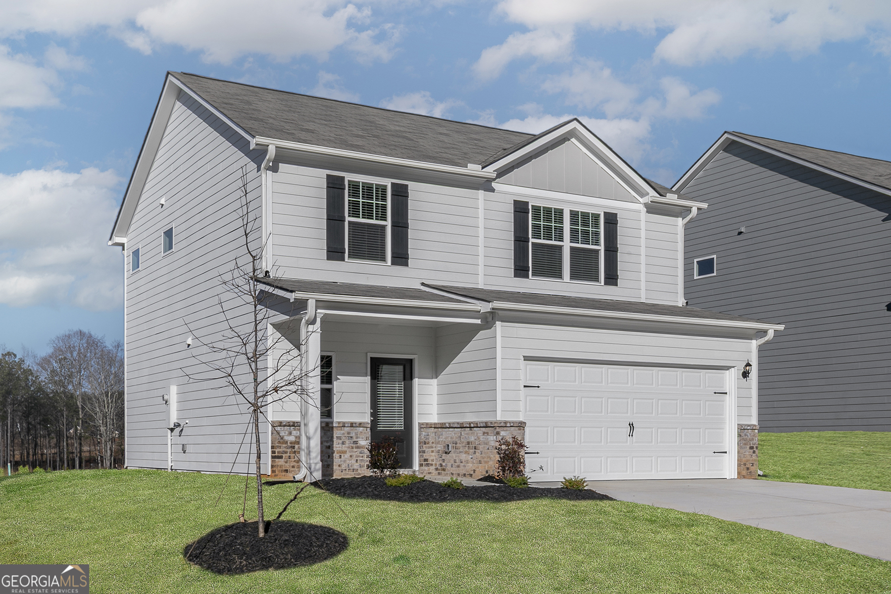 482 Prescott Way Villa Rica, GA 30180 - Photo 3 of 17 a front view of a house with a yard and garage