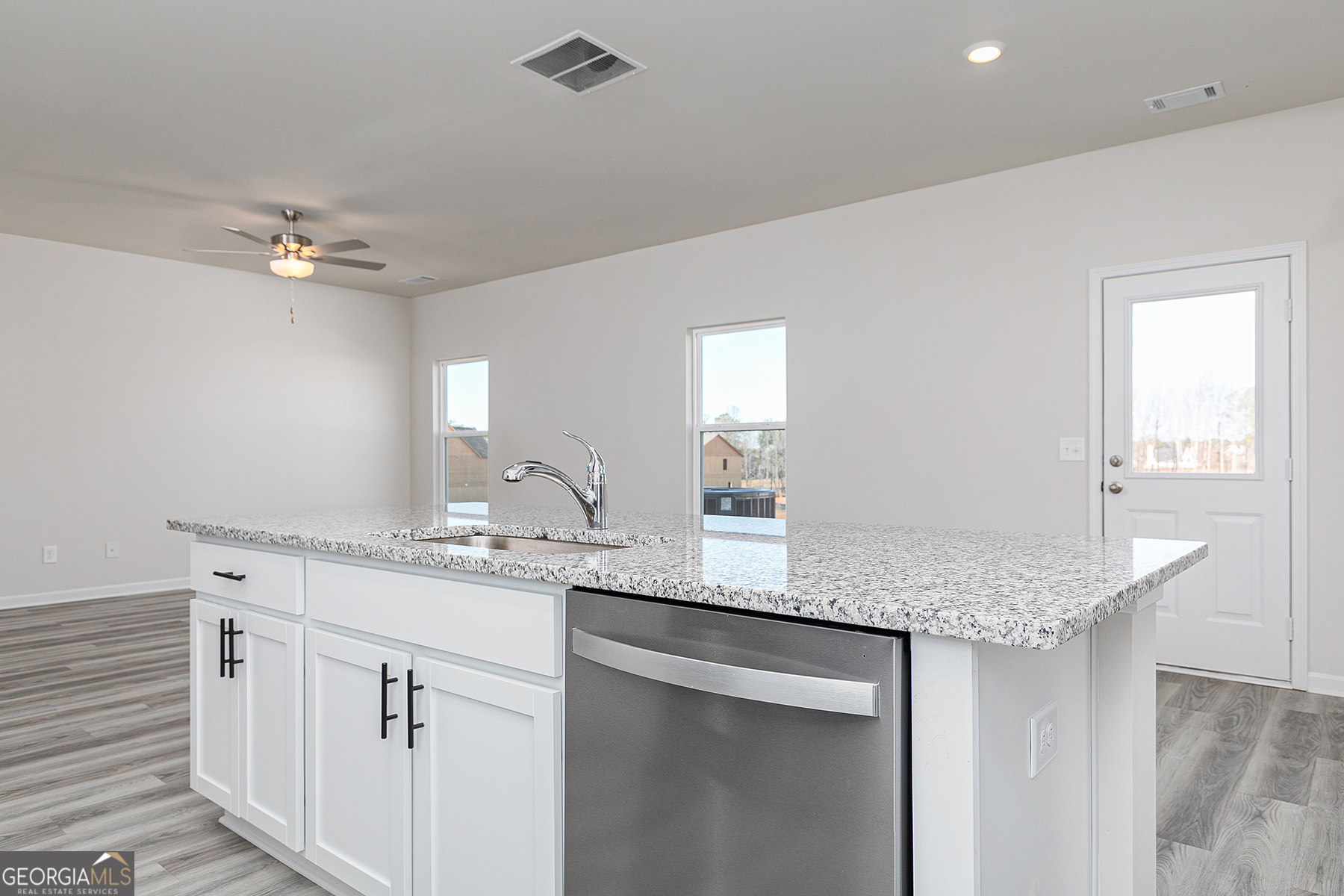482 Prescott Way Villa Rica, GA 30180 - Photo 10 of 17 a kitchen with granite countertop a sink stainless steel appliances and cabinets