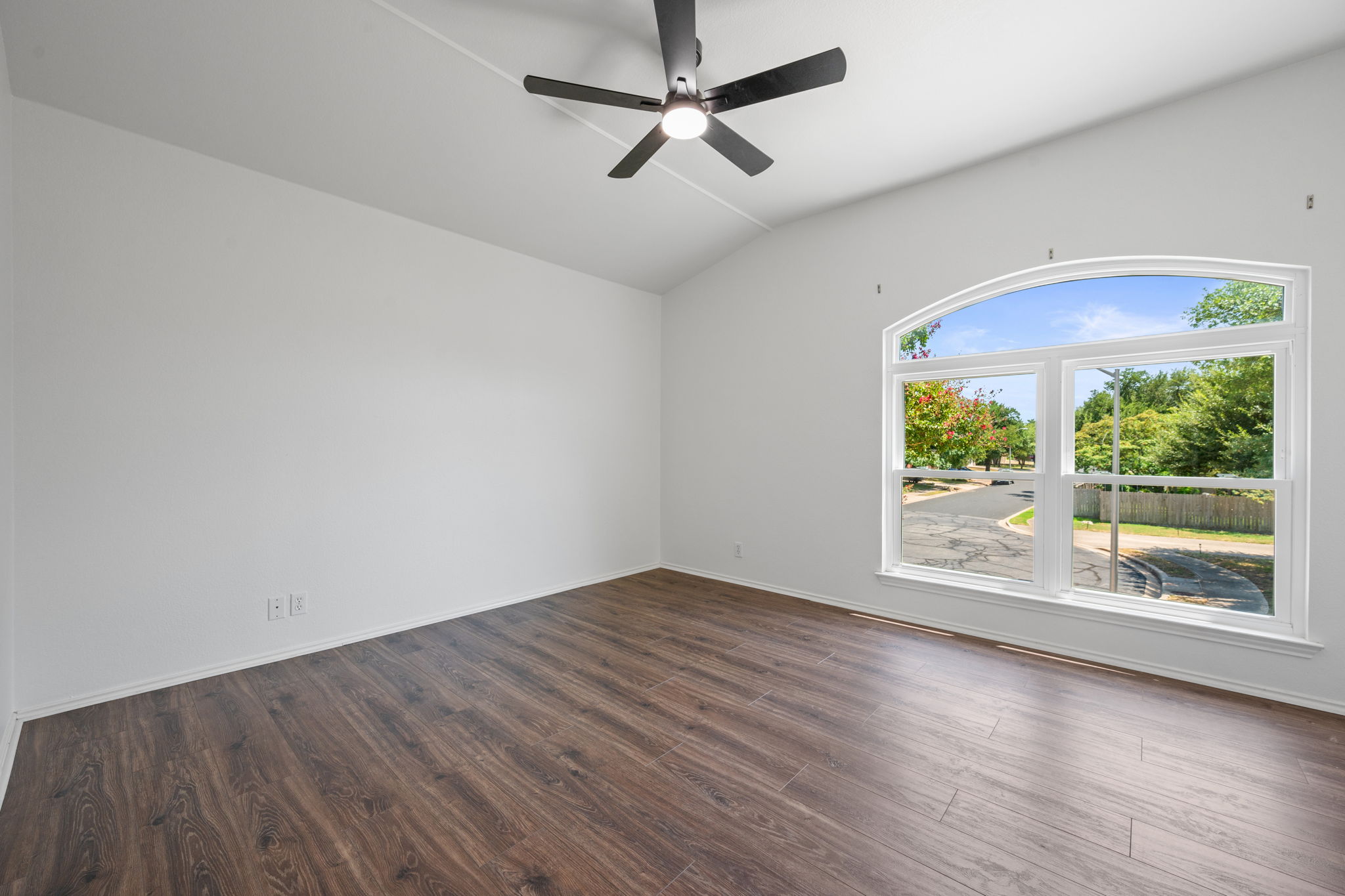 2440 Madeline Loop Cedar Park, TX 78613 - Photo 27 of 33 Spare room with lofted ceiling, dark wood-style flooring, and ceiling fan