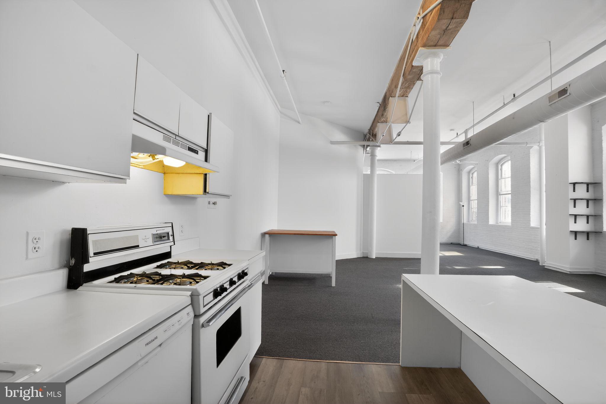 408 Vine Street, Unit 2A Philadelphia, PA 19106 - Photo 12 of 19 a kitchen that has a sink and a stove