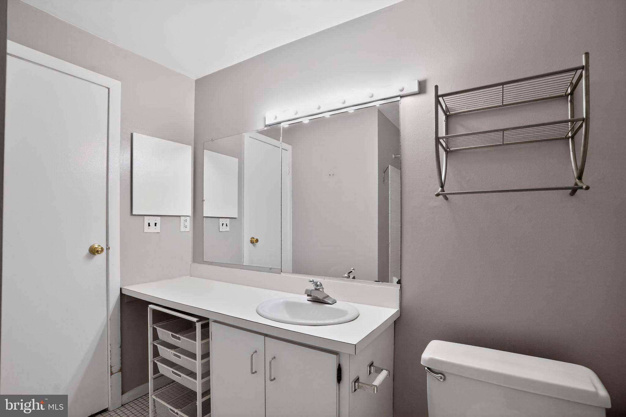 408 Vine Street, Unit 2A Philadelphia, PA 19106 - Photo 19 of 19 a bathroom with a sink toilet vanity and shower