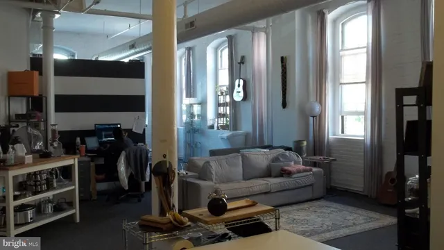 a kitchen with a refrigerator and a stove