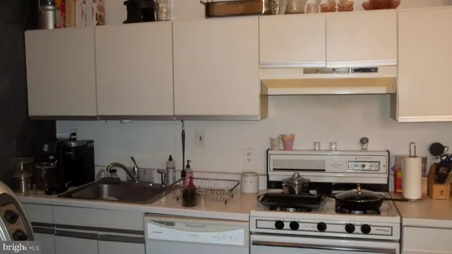 a kitchen with a stove and cabinets