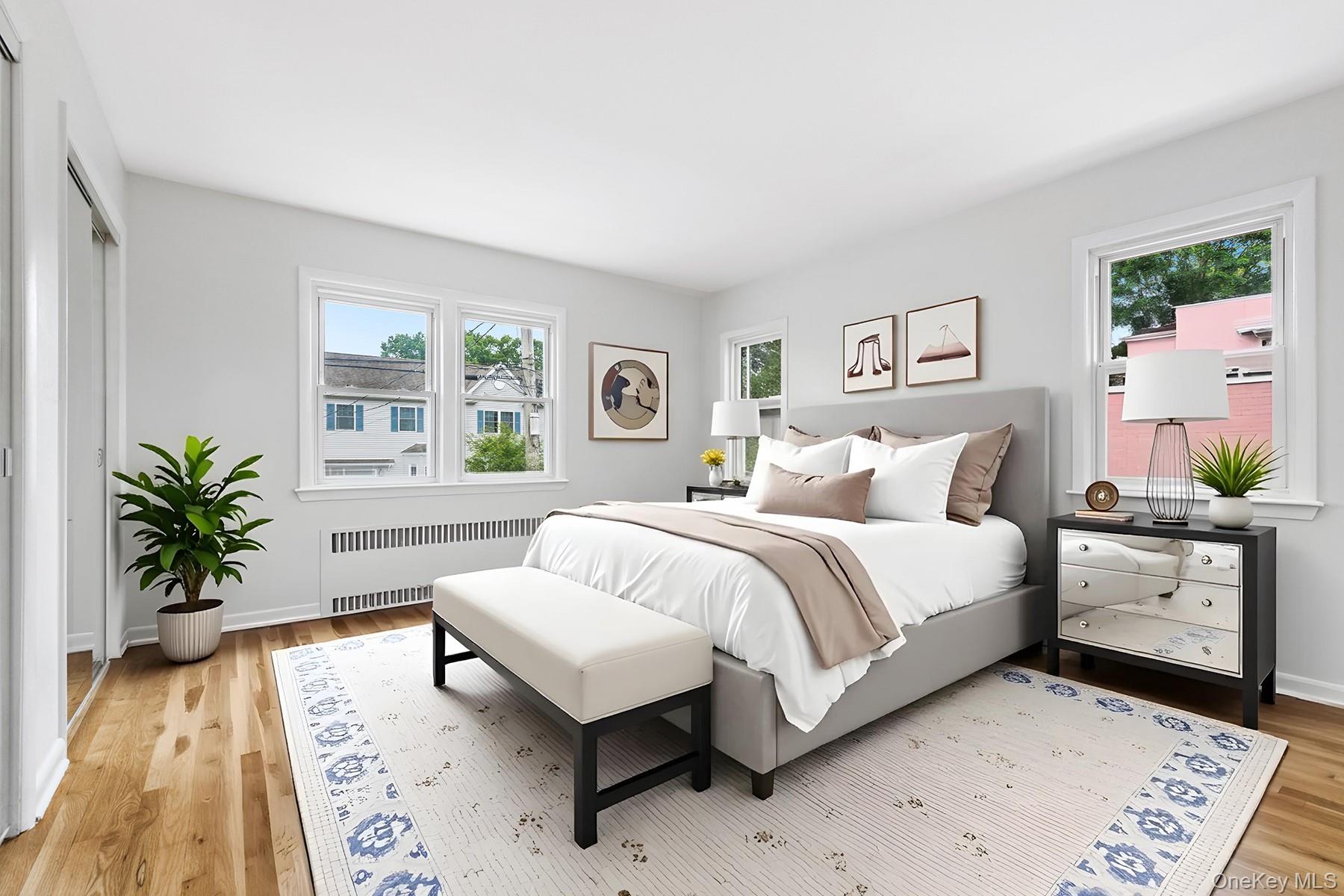 46 Mathews Street Harrison, NY 10528 - Photo 14 of 30 a bedroom with a bed and a couch