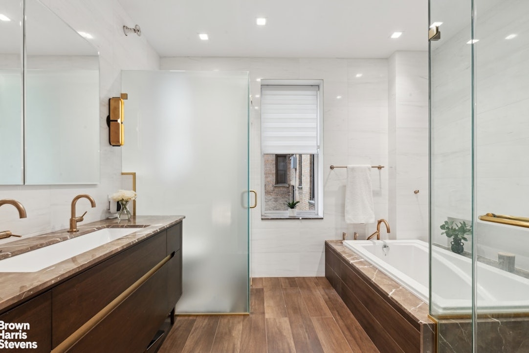 37 West 93rd Street, Unit 17/13 Manhattan, NY 10025 - Photo 8 of 11 a bathroom with a bathtub and a sink