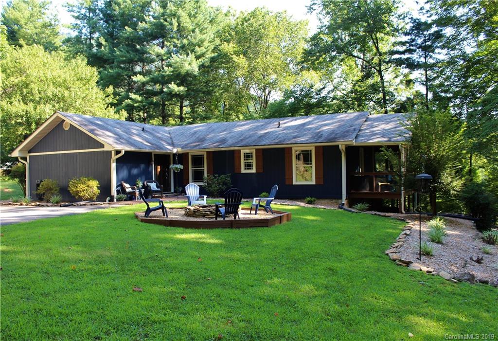 a front view of a house with garden and patio